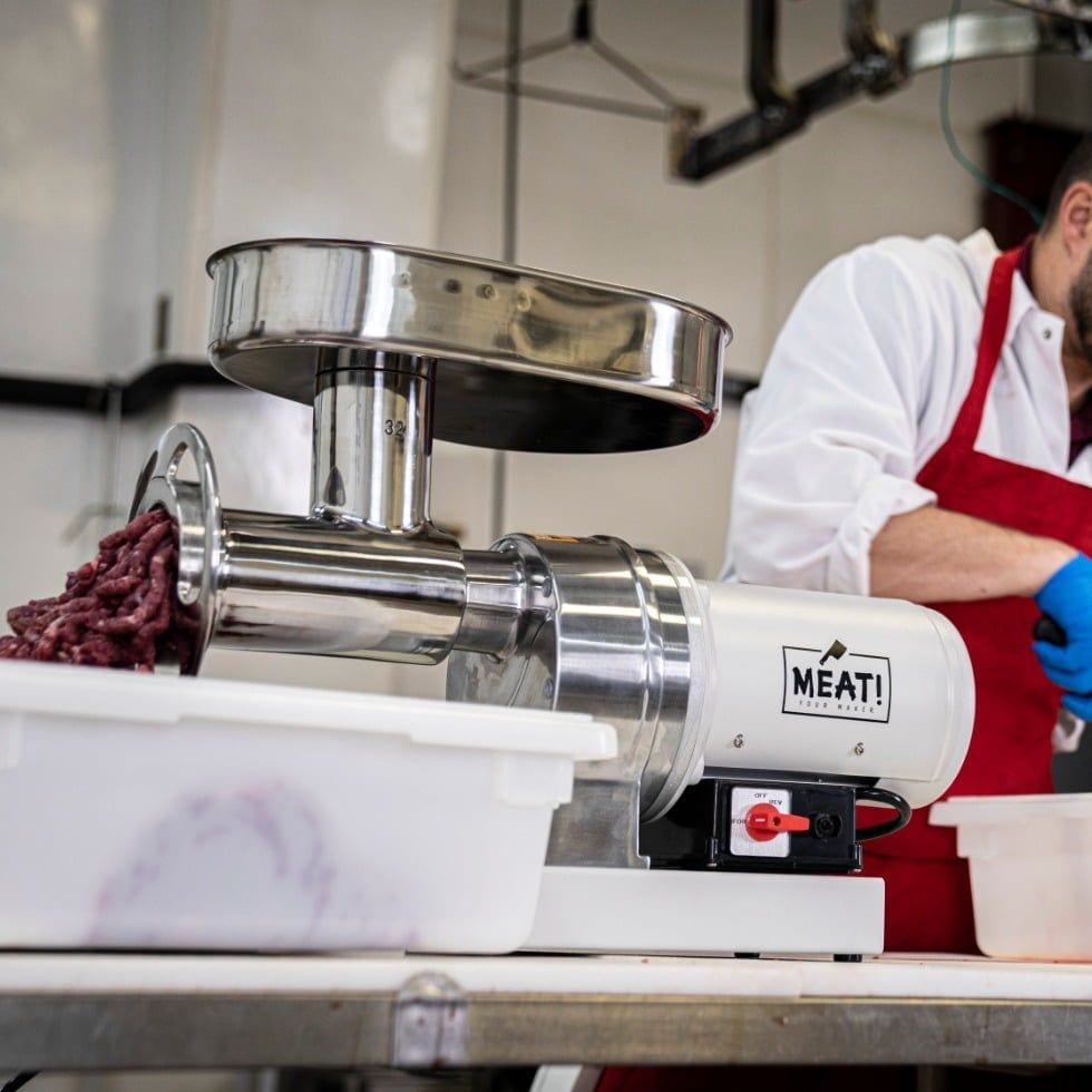 MEAT! Your Maker 1.5 HP Grinder #32 grinding meat in a butcher shop